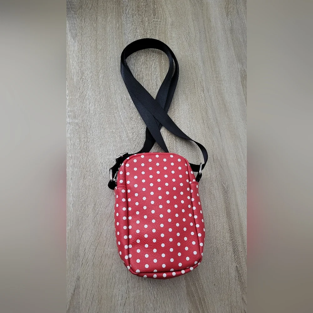 Minnie Mouse Crossbody with iconic polka dots. Brand is Buckle‎ Down.